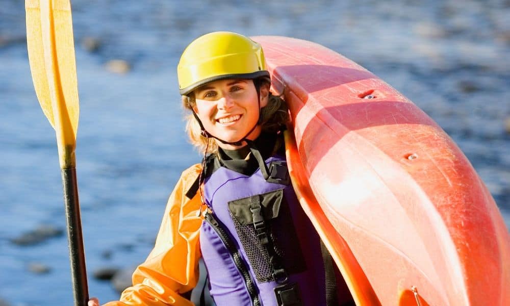 woman with kayaking equipment