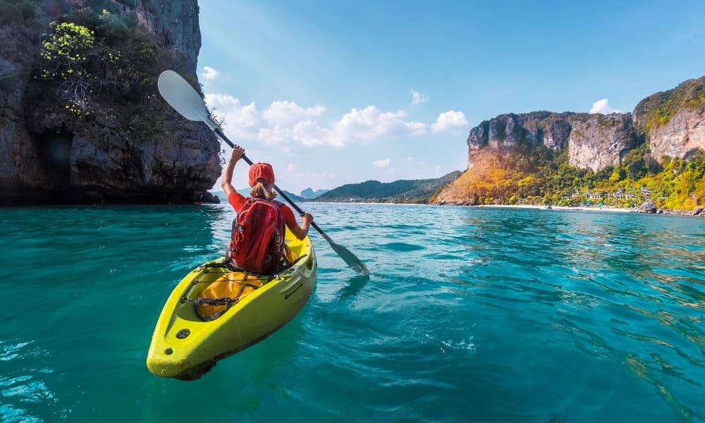 kayaker paddling on calm waters