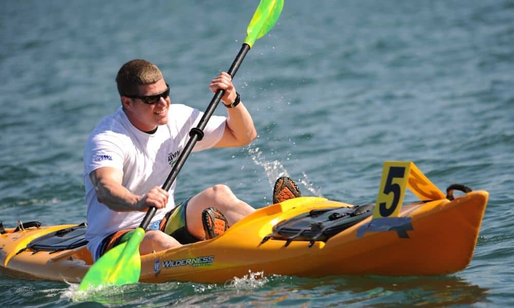 man paddling a kayak