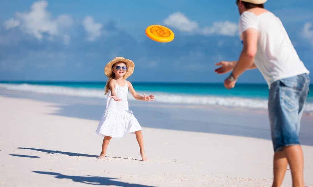 playing frisbee at the beach