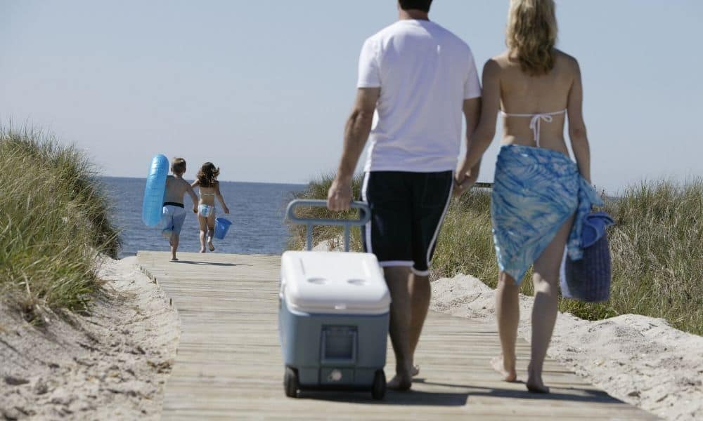 rolling a beach cooler
