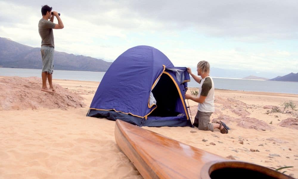 setting up a beach tent