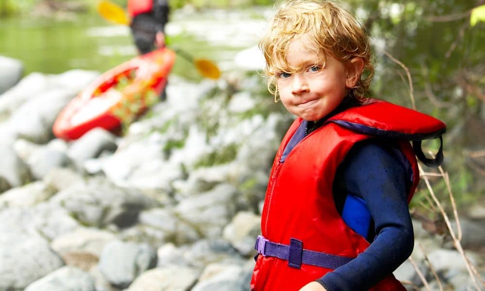 young boy wearing a life jacket