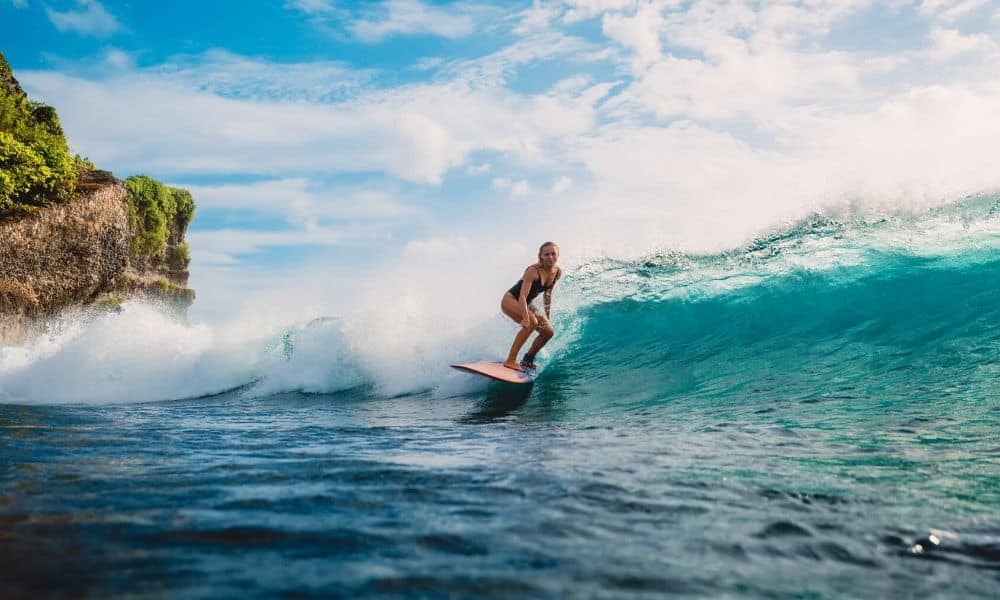 Woman surfing in Bali