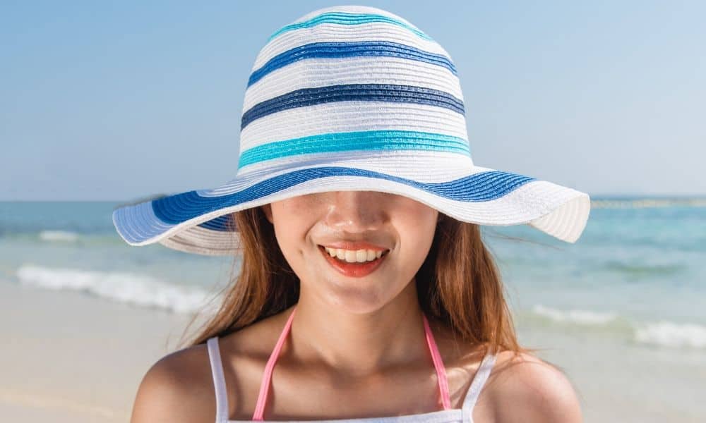 woman wearing a beach hat
